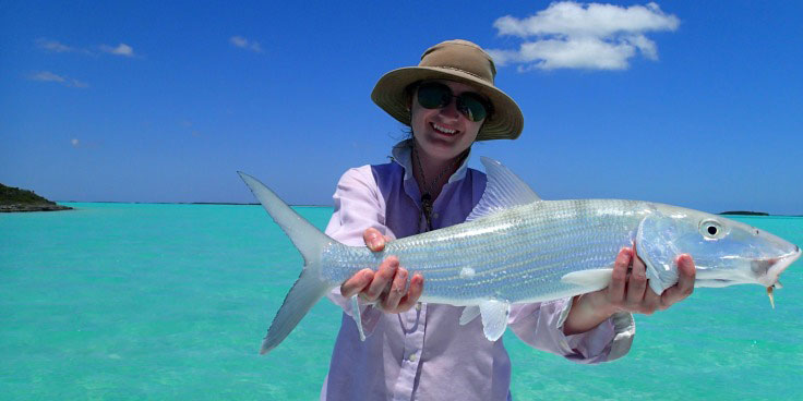 woman-holding-bonefish-beautiful-flats-andros-bahamas